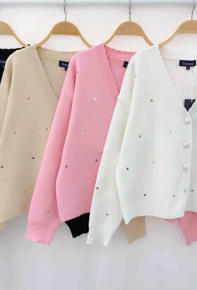 Short cardigan. sprinkled with touches of sequins